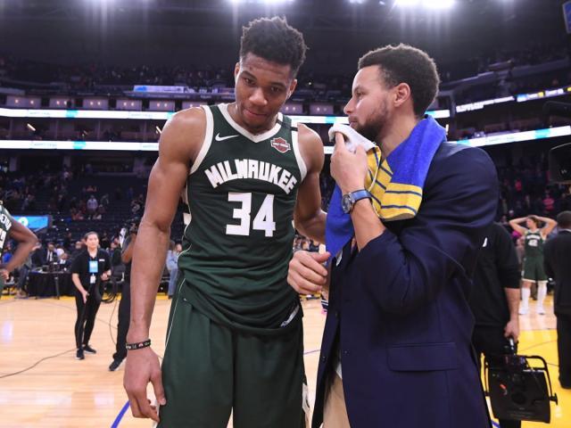 1661878881319023045.jpg giannis_curry_getty.jpg